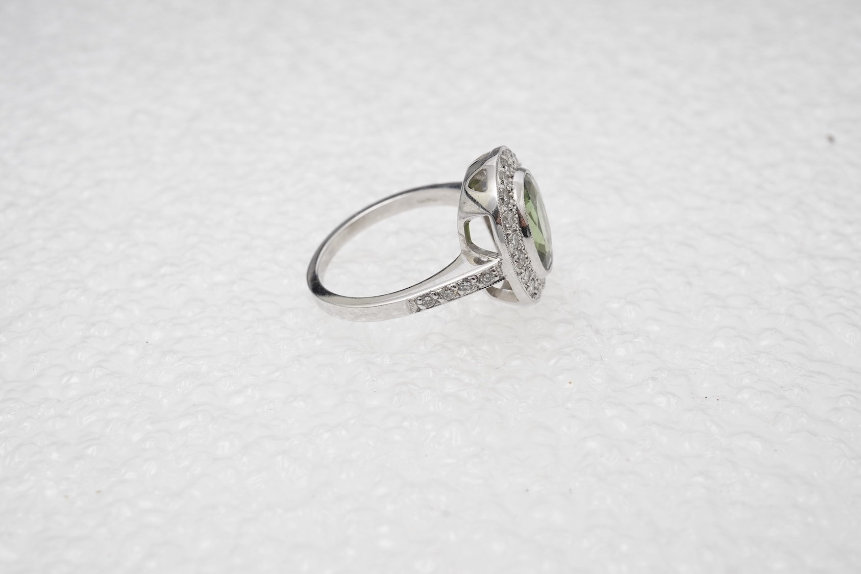 A green tourmaline and diamond cluster ring